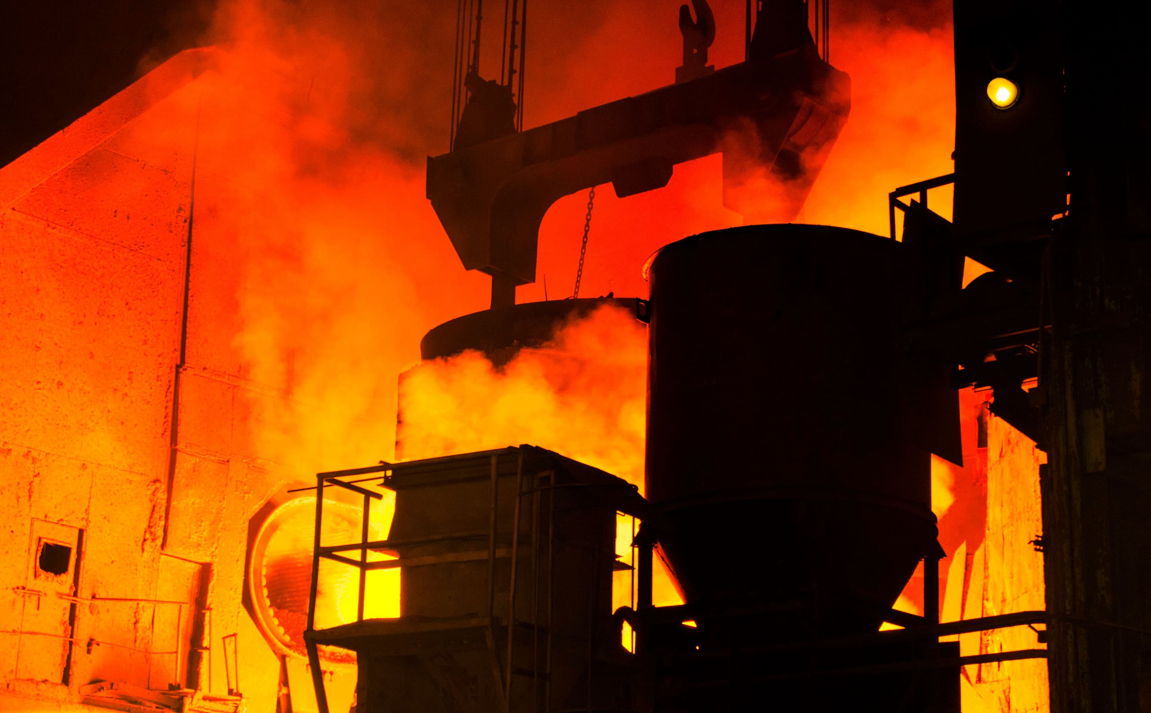 Molten metal casting in an active steel mill