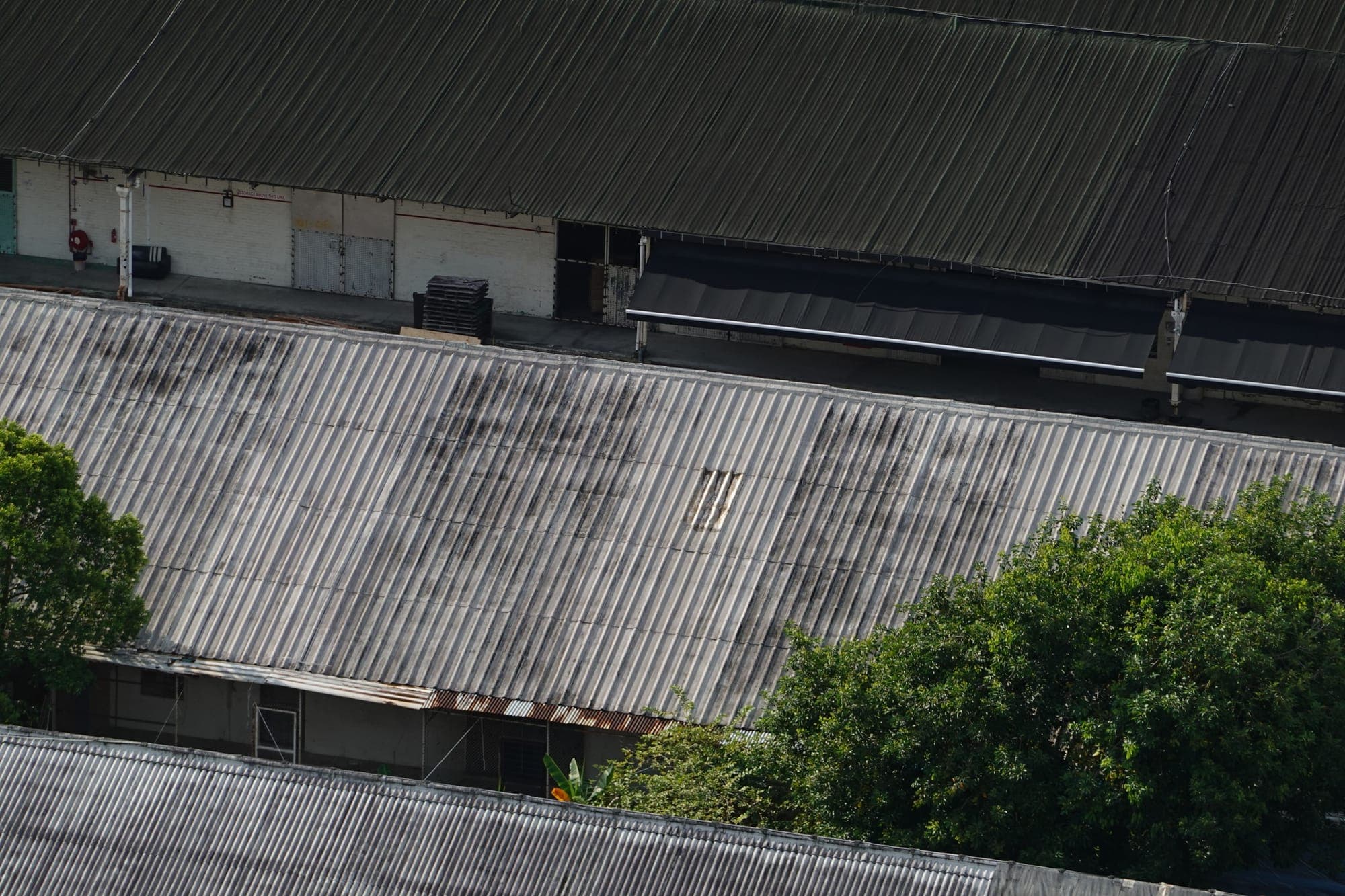 Aerial view of corrugated metal warehouse roofs