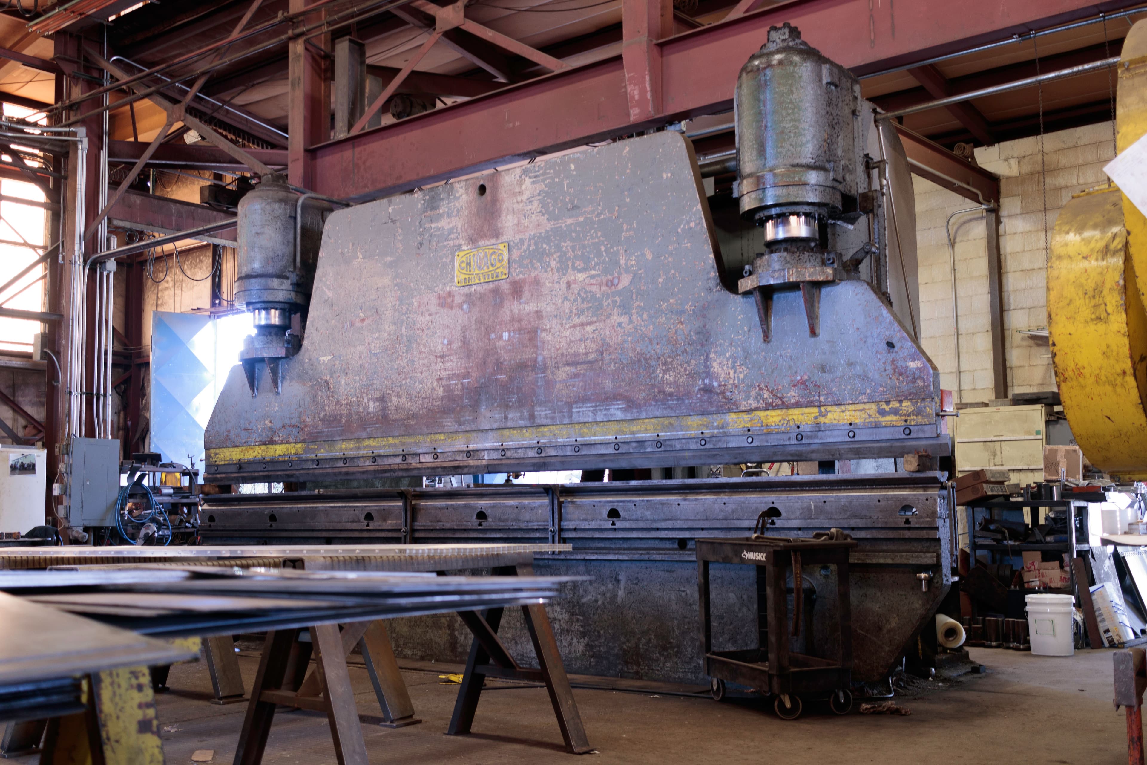 Large steel press brake machine in a factory